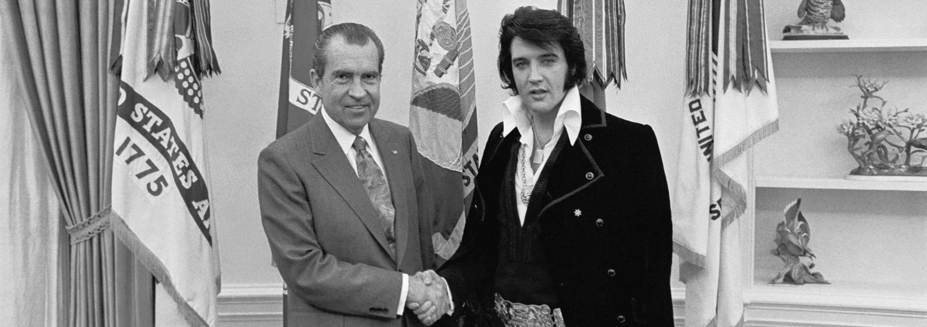 Richard Nixon shaking hands with Elvis at the White House