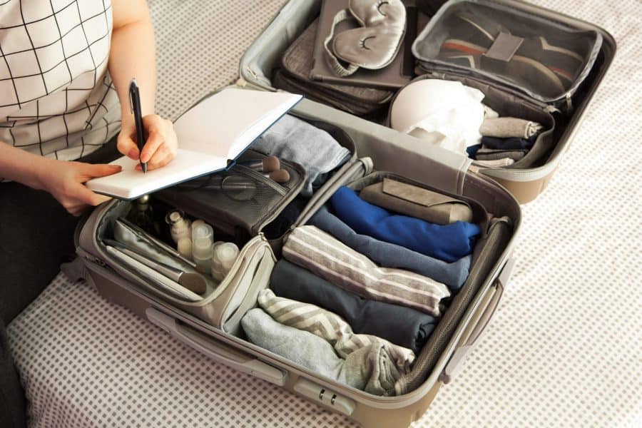 A woman packing for residential addiction treatment.