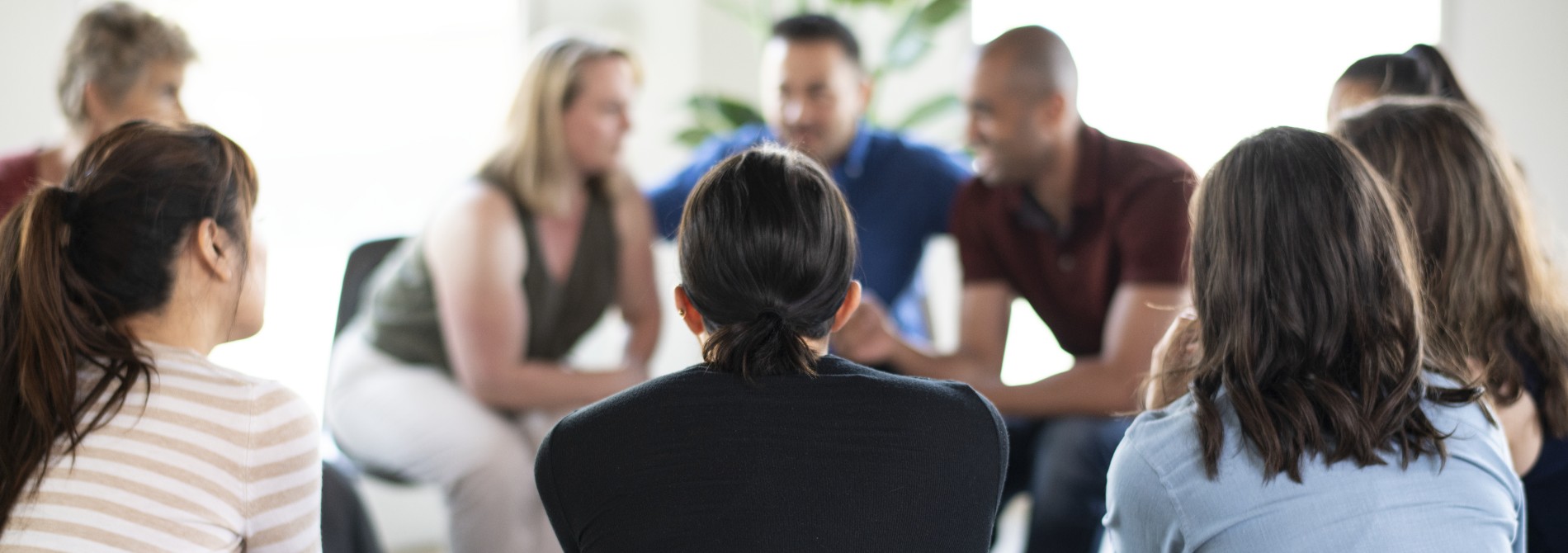 People sitting in a circle for a support group meeting